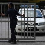 Malaysian police car leaving a court